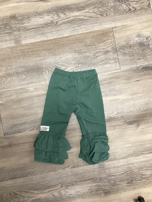 Green ruffled leggings